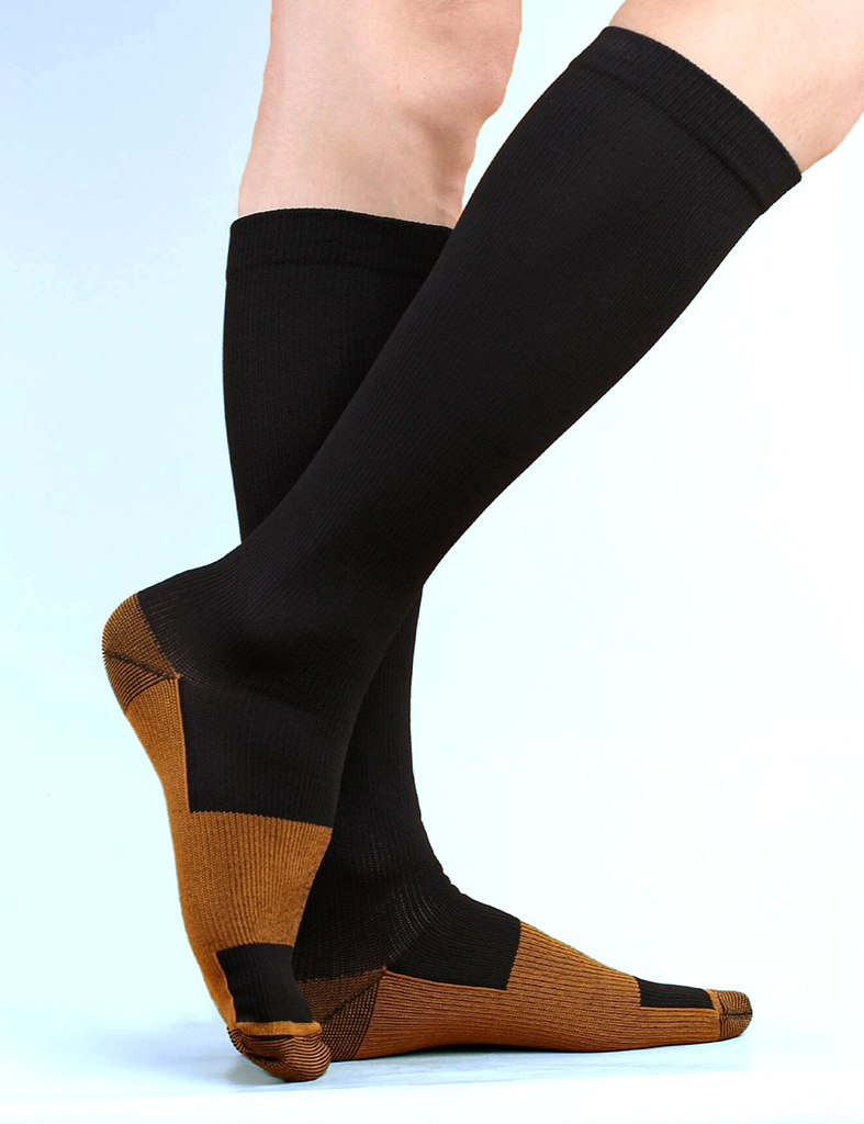 Woman's leg standing side view position wearing black color Copper Compression Socks.