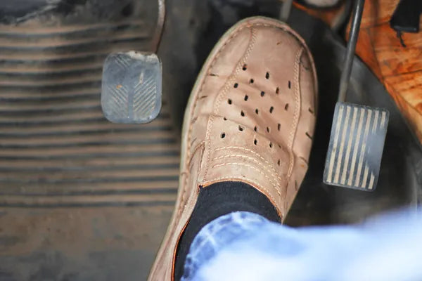 A truck driver wearing black color compression socks