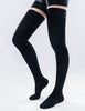 Leg standing wearing black color thigh-high closed-toe compression socks.
