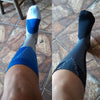 The image shows a leg of a woman wearing Joocla graduate compression socks, it shows the view of Black and Blue color of the compression socks.