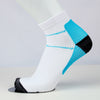 close image of a white color ankle-length compression socks, the socks has a blue and black design weaving in fabric