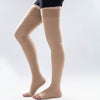 Side view of a leg wearing beige color thigh-high open toe compression socks.